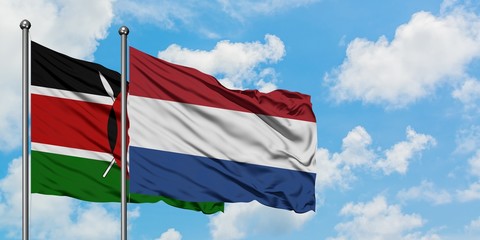 Kenya and Netherlands flag waving in the wind against white cloudy blue sky together. Diplomacy...