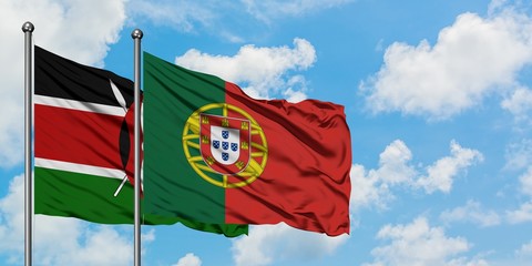 Kenya and Portugal flag waving in the wind against white cloudy blue sky together. Diplomacy concept, international relations.