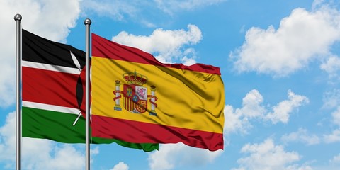 Kenya and Spain flag waving in the wind against white cloudy blue sky together. Diplomacy concept, international relations.