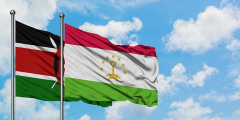 Kenya and Tajikistan flag waving in the wind against white cloudy blue sky together. Diplomacy...