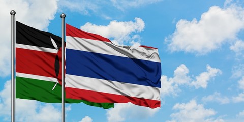 Kenya and Thailand flag waving in the wind against white cloudy blue sky together. Diplomacy concept, international relations.