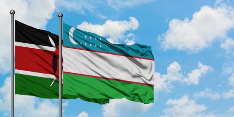Kenya and Uzbekistan flag waving in the wind against white cloudy blue sky together. Diplomacy concept, international relations.