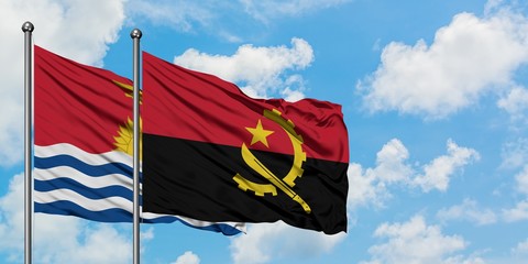 Kiribati and Angola flag waving in the wind against white cloudy blue sky together. Diplomacy concept, international relations.