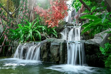 Fotobehang Artificial tropical garden waterfall © bohbeh
