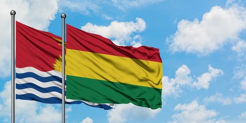 Kiribati and Bolivia flag waving in the wind against white cloudy blue sky together. Diplomacy concept, international relations.