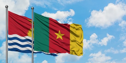 Kiribati and Cameroon flag waving in the wind against white cloudy blue sky together. Diplomacy concept, international relations.