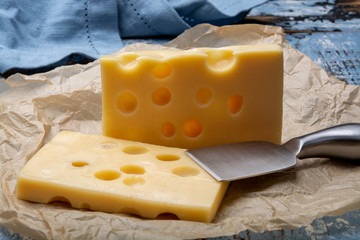 Two blocks of French emmental semi-hard cheese