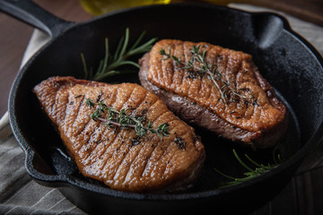 grilled duck breast meat with skillet
