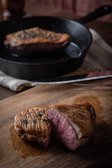 grilled duck breast meat with skillet
