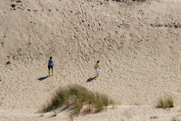 Parnidis dune in Nida. The Curonian Spit. Sand and Grass. People Walking On the Sand Dunes Images....