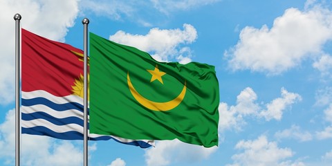 Kiribati and Mauritania flag waving in the wind against white cloudy blue sky together. Diplomacy concept, international relations.