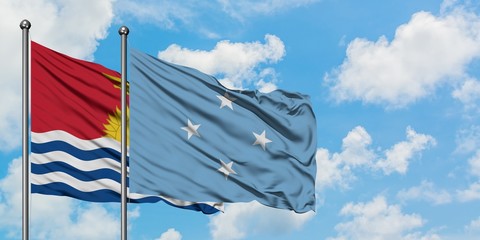 Kiribati and Micronesia flag waving in the wind against white cloudy blue sky together. Diplomacy concept, international relations.