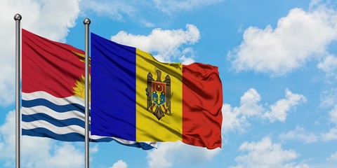 Kiribati and Moldova flag waving in the wind against white cloudy blue sky together. Diplomacy concept, international relations.