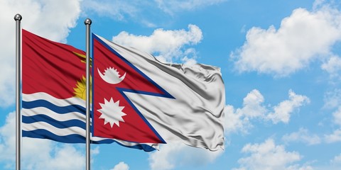 Kiribati and Nepal flag waving in the wind against white cloudy blue sky together. Diplomacy concept, international relations.