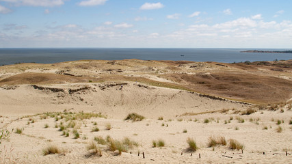 Parnidis dune in Nida. The Curonian Spit. Sand and Grass. People Walking On the Sand Dunes Images. Baltic Sea