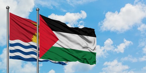 Kiribati and Palestine flag waving in the wind against white cloudy blue sky together. Diplomacy concept, international relations.