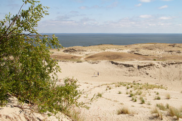 Parnidis dune in Nida. The Curonian Spit. Sand and Grass. People Walking On the Sand Dunes Images....