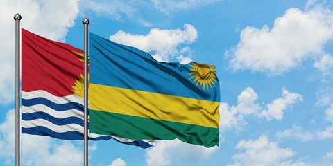 Kiribati and Rwanda flag waving in the wind against white cloudy blue sky together. Diplomacy concept, international relations.