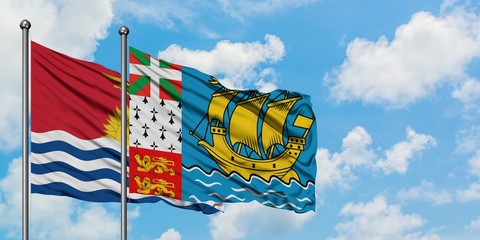 Kiribati and Saint Pierre And Miquelon flag waving in the wind against white cloudy blue sky together. Diplomacy concept, international relations.
