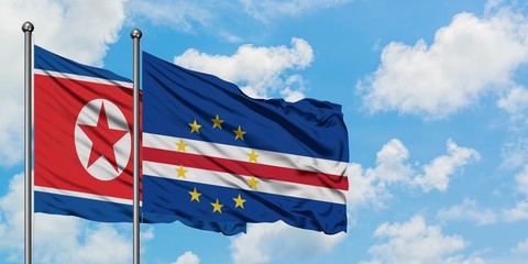 North Korea and Cape Verde flag waving in the wind against white cloudy blue sky together. Diplomacy concept, international relations.