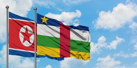 North Korea and Central African Republic flag waving in the wind against white cloudy blue sky together. Diplomacy concept, international relations.