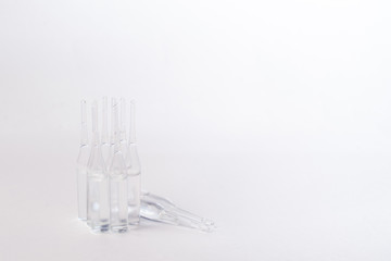 transparent medical ampoules on a white background
