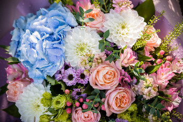 Beautiful bouquet of bride wedding flowers blue hydrangea, fresh pink roses and alstroemeria, bridal decoration. Fresh flowers in summer day. Marriage day. stylish beautiful bouquet for birthday.