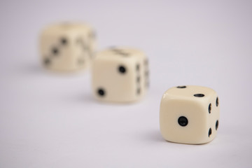 White dice with black dots in white background