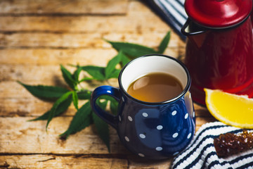 Marijuana herbal tea and cannabis leaves