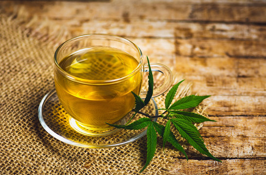 Marijuana herbal tea and cannabis leaves