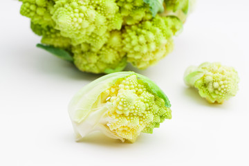 Fresh Romanesco cauliflower on the light background