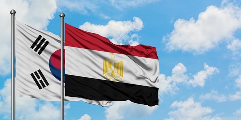 South Korea and Egypt flag waving in the wind against white cloudy blue sky together. Diplomacy concept, international relations.
