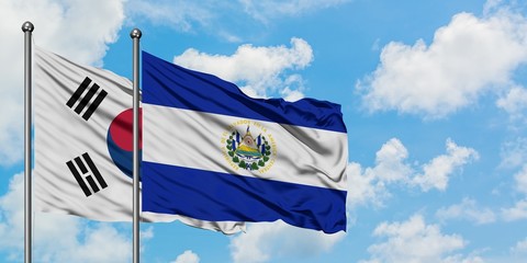 South Korea and El Salvador flag waving in the wind against white cloudy blue sky together. Diplomacy concept, international relations.