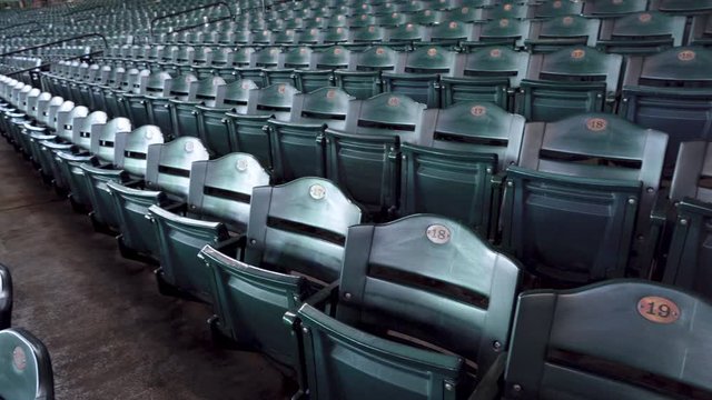 Baseball Stadium Seating with Empty Green fold up seats.