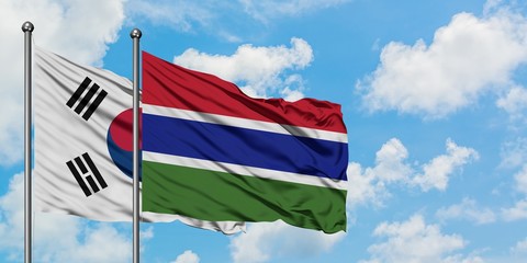 South Korea and Gambia flag waving in the wind against white cloudy blue sky together. Diplomacy concept, international relations.