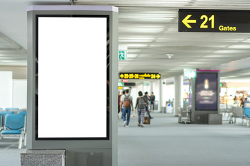 Blank white mock up of vertical light box billboard at the airport - obrazy, fototapety, plakaty