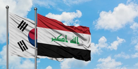 South Korea and Iraq flag waving in the wind against white cloudy blue sky together. Diplomacy concept, international relations.