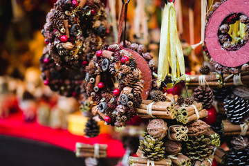 Festive decorations hanging on european Christmas market.