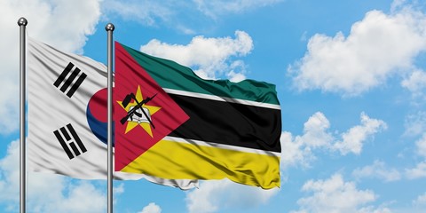 South Korea and Mozambique flag waving in the wind against white cloudy blue sky together. Diplomacy concept, international relations.