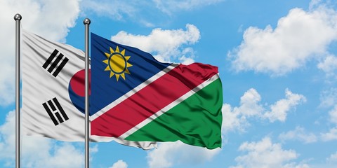 South Korea and Namibia flag waving in the wind against white cloudy blue sky together. Diplomacy concept, international relations.
