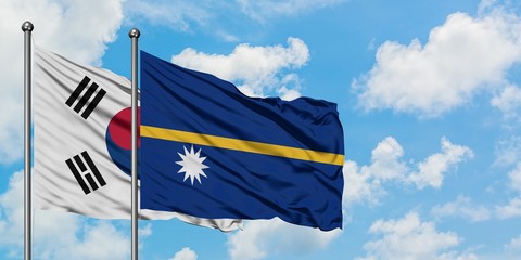 South Korea and Nauru flag waving in the wind against white cloudy blue sky together. Diplomacy concept, international relations.