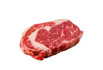  Een rib eye steak van gemarmerd graangevoerd rundvlees ligt op een witte achtergrond. Geïsoleerd. © milanchikov