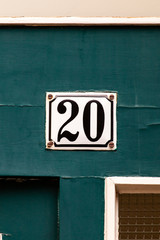 number twenty placard on green stone background