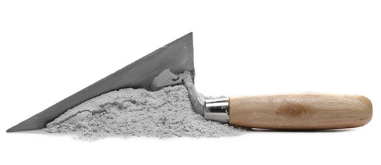 Cement pile and trowel isolated on white background