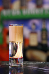 Alcoholic cocktail Nipple. Shot Nipple at the bar.