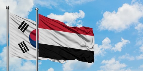 South Korea and Yemen flag waving in the wind against white cloudy blue sky together. Diplomacy concept, international relations.