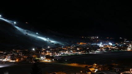 Fototapeta na wymiar Livigno popular sky resort in Italy by night
