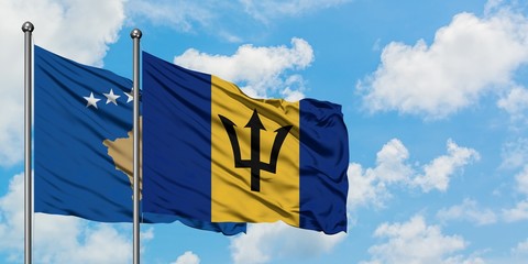 Kosovo and Barbados flag waving in the wind against white cloudy blue sky together. Diplomacy concept, international relations.