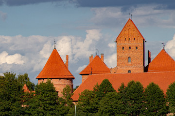 The Medieval Trakai Island Castle. Red roofs and walls, blue sky. Most prominent tourist...