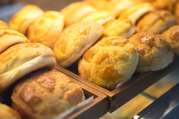 Fresh bread on shelves in bakery shop at supermarket store